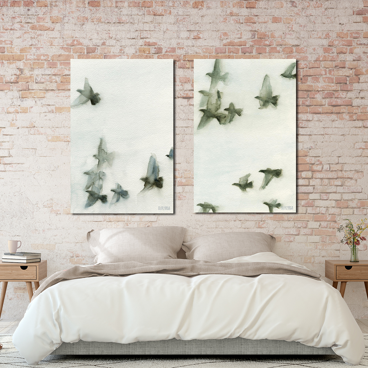 Set of two grey and blue canvas birds in flight wall art prints over the bed. www.beverlybrown.com